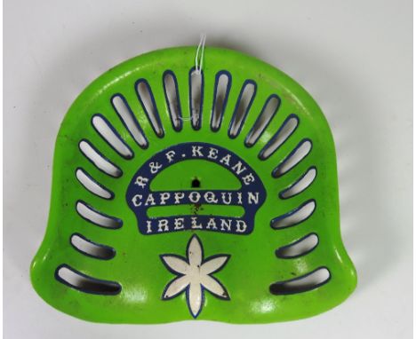 A "R. & F. Keane, Cappoquin (Waterford) Ireland" Tractor Seat, painted green, blue and white text G.B. 35 / 6, Rate 9. (1)