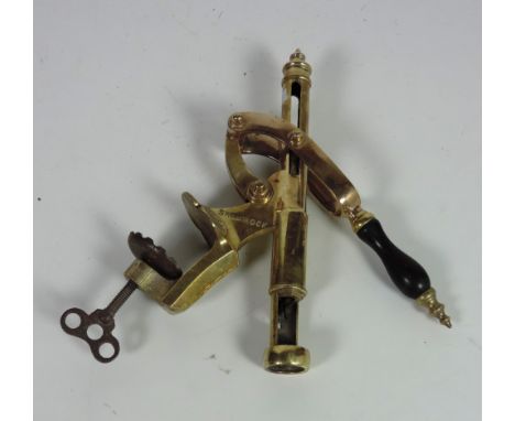 A heavy brass "Shamrock" model Bottle Opener, with an oval brass label 'M. Jordi & Co. ...Dublin,' No. 1232, with inset woode