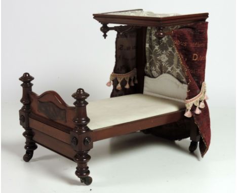 A rare Victorian period miniature mahogany half-tester Canopy Bed, the moulded canopy with turned rails and finials, upholste