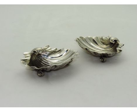 By Paul Storr

A fine and rare pair of late Georgian English silver Butter Shells, of typical form with fluted shell bowls, e