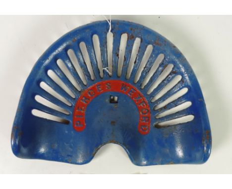 A "Pierce, Wexford" Tractor Seat, painted blue and red, G.B. 46, 2/6, Rate 8. (1)