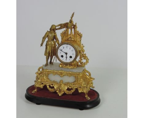 An attractive 19th Century French gilt metal and marble Mantle Clock, by Japy Freres, Paris, surmounted with a figure of Joan