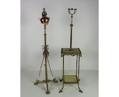 An Edwardian brass and copper decorated Standard Lamp; and another brass Standard Lamp with two marble Shelves. (2)