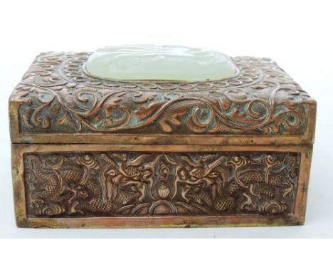 An unusual late 19th Century heavy copper Box, with hand worked designs of dragons, branches and leaves, the lid with inset c
