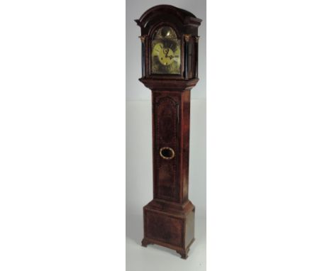 A fine elegant 18th Century English marquetry walnut and crossbanded Longcase Clock, the moulded dome top with a fret carved 