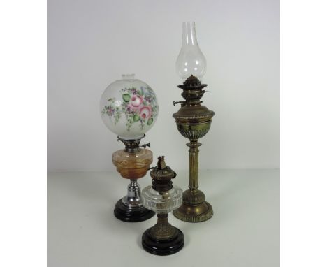 An large Edwardian circular brass Table Lamp, with reeded pillar and body; and two other Table Lamps with cutglass bowls, one