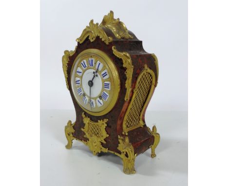 A very fine and attractive 19th Century French Louis XV style red boulle ormolu mounted Mantle Clock, by T. Cox Savory & Co.,