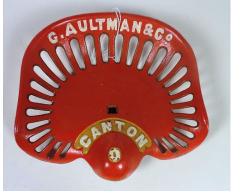 A "G. Aultman & Co." square hole Tractor Seat, painted red, with white text F48, Rate 5. (1)