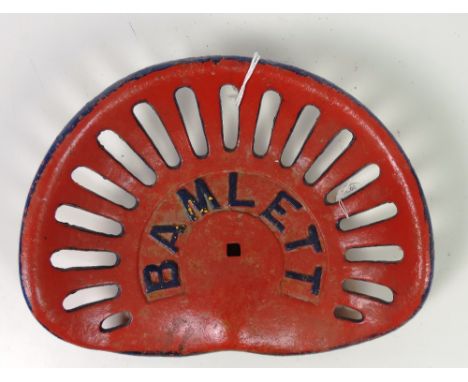 A "Bamlett" Tractor Seat, painted in red and blue, G.B. 6.4, Rate 2; FR 73, Rate 4. (1)