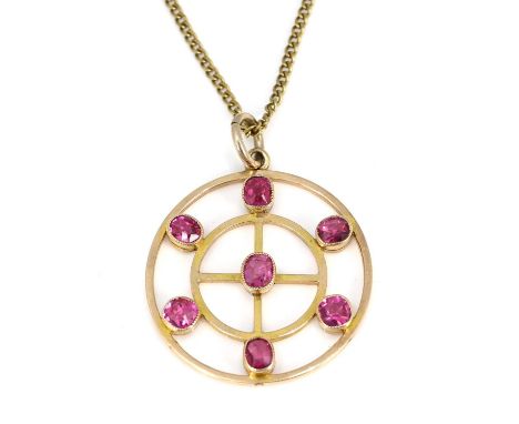 A 15 carat gold and pink stone pendant, double concentric ring with central cross, seven cushioned stones, on a chain, 3cm di