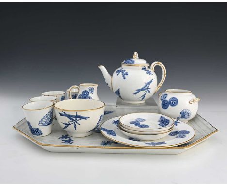 James Hadley for Royal Worcester, an Aesthetic Movement cabaret tea set, 1878, including large plank moulded tray, teapot, ju