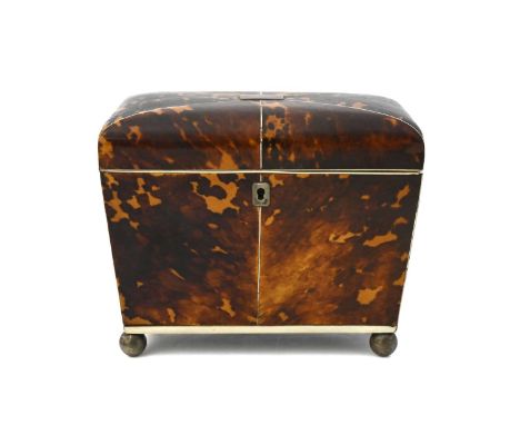 A Regency tortoiseshell tea caddy, circa 1820, of sarcophagus form, ivory strung, twin-lidded inner compartments, on metal ba