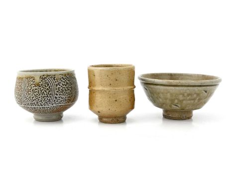 Phil Rogers, three studio pottery bowls, including a Japanese style banded beaker, a combed saltglazed bowl and celadon bowl,