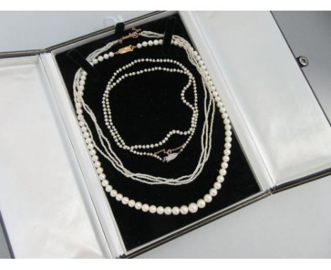 A row of graduated cultured pearls and two seed pearl necklaces,   the first necklace of graduated 4.5-8.0mm cultured pearls 