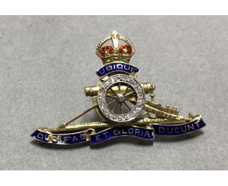 An early 20th century diamond and enamel Regimental brooch for the Royal Artillery, with red and green enamelled crown surmou
