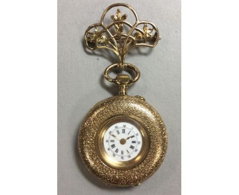 An unsigned continental lady's open faced fob watch, the miniature white enamel dial with black Roman numerals, minute track 