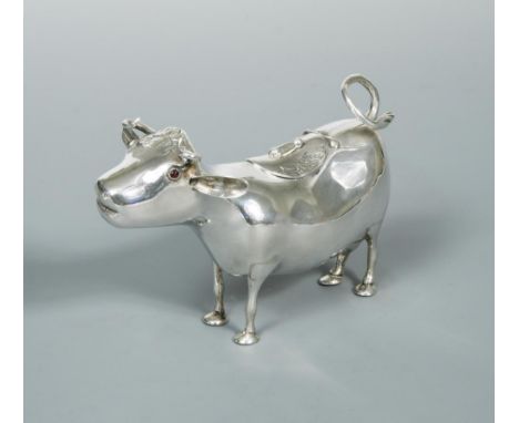 A 20th century Schuppe style cow creamer, indistinctly marked to the belly, possibly Dutch, Friesland 1900, of plain form wit