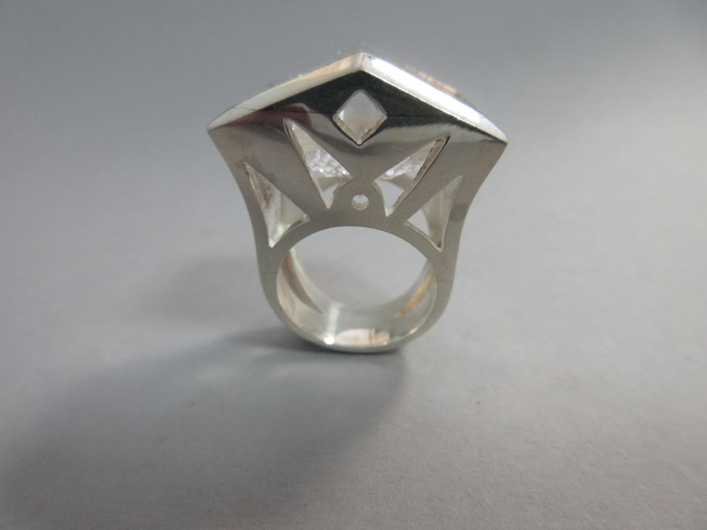 A futuristic rock crystal 'knuckle duster' ring, the fancy ...