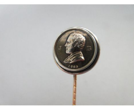 A memorial stick pin for John Brown, in the form of a medallion with the ghillie's portrait bust, initials JB and date of dea