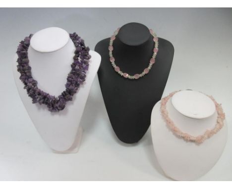 A rose quartz and prehnite necklace together with a three row amethyst chip necklace and another of rose quartz chips, the fi