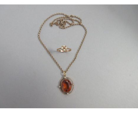 A citrine and seed pearl pendant on gold chain together with a pearl and gold ring, the pendant with an oval facetted deep go