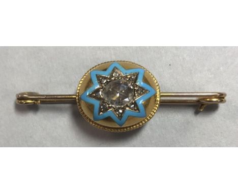 A diamond and enamel bombé pin brooch, of safety pin type set to the centre with an oval bead-edged boss containing an oval r