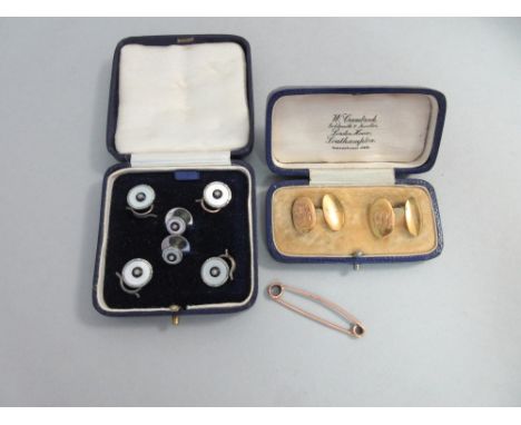 A pair of antique gold double-ended cufflinks together with other gentleman's requisites, the cufflinks of oval convex form, 