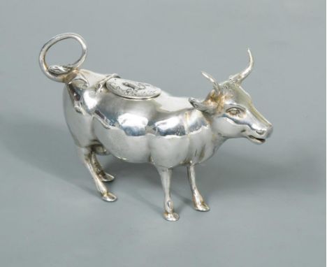 An Edward VII silver semi naturalistic cow creamer, sponsor's mark George Bedingham, London import marks, 1908 in addition to