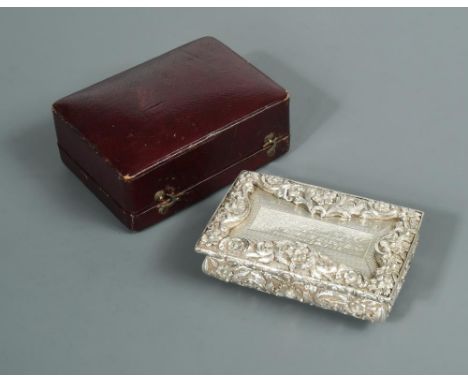 A Victorian silver snuffbox by Joseph Wilmore, Birmingham 1844, of rectangular form, the body covered with repoussé foliate d
