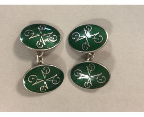 A pair of Sterling silver and guilloché enamel cufflinks by Asprey & Garrard, each oval link decorated with a pattern of four