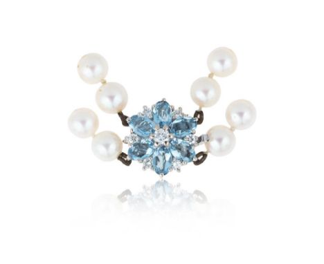 A two row cultured pearl necklace with a diamond and aquamarine cluster clasp set in 18ct white gold, the uniform 6.5-7mm pea
