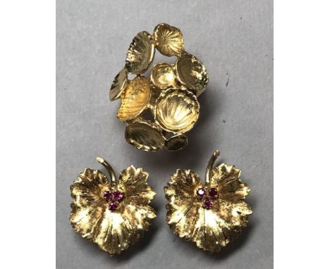 A pair of 1960s 18ct gold and ruby 'leaf' earclips together with an abstract 18ct gold ring of the same era, each earring des