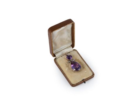 An antique amethyst and diamond pendant in period leather case, the integral suspensory loop fronted by an old round brillian
