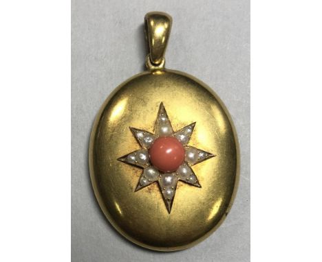 A Victorian hairwork, coral and seed pearl pendant, of oval outline, the front with a central coral bead in an eight point st