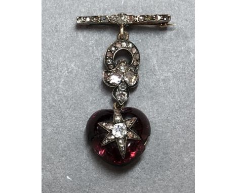 A Victorian diamond and garnet heart and star pendant brooch, designed as a short bar brooch set with old cushion cut and ros