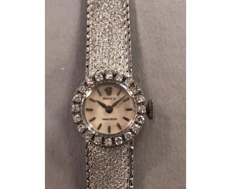 Rolex - A lady's 18ct gold precision dress watch, circa 1965, the circular signed cream coloured dial with silver coloured ba