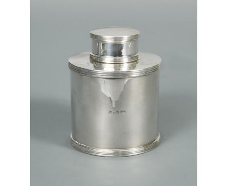 A George V silver drum tea caddy, by Mappin & Webb, London 1923, of plain design with reeded base and top, the friction fitti