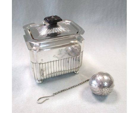 A Victorian silver tea caddy and a 20th century tea infuser, the caddy, London 1899, of rectangular form with half gadrooned 