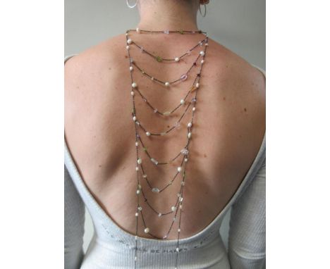 A freshwater pearl and gem set 'ladder' necklace or back ornament, composed of two lengths of fine trace link chain set at in