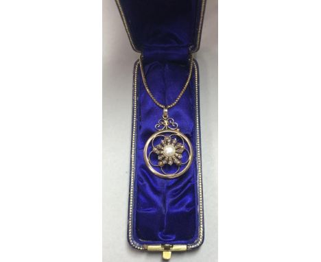 A pearl and diamond pendant and chain with Royal provenance, the pendant with a 5.5mm bouton pearl centre in a fringe of tape