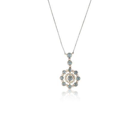 An Edwardian aquamarine and seed pearl pendant with chain, designed as an articulated and alternating line of two round cut a