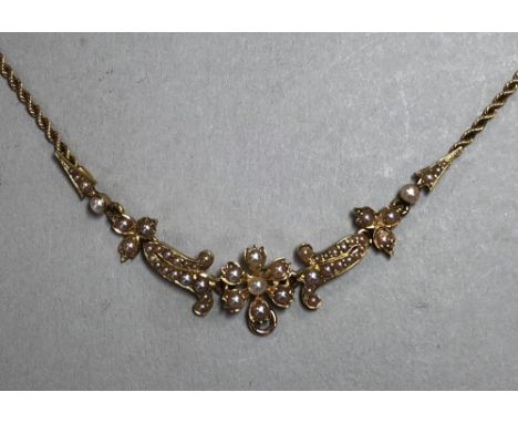 A seed pearl flower and ropetwist chain necklace, the articulated central section with flower and foliate motifs set througho