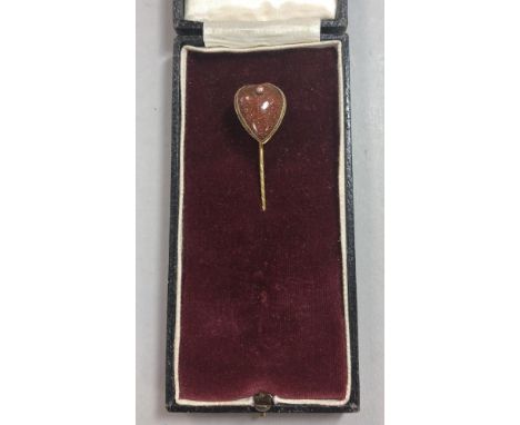 A heart shaped sunstone stick pin, the natural copper-coloured stone has multiple haematite flecks that create the sparkle, p