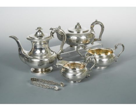 A George IV silver four piece tea and coffee set and sugar tongs on a silver plated tray, the teapot by Joseph Angel II, Lond