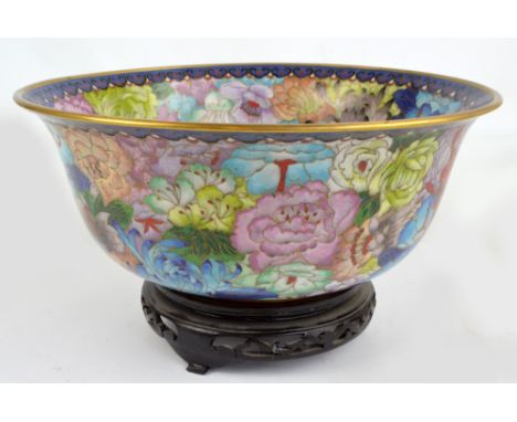 A large modern Chinese cloisonné enamel bowl, decorated with various floral motifs to outside and inside, diameter 30.5cm, on
