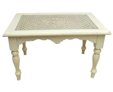 A modern cream pained rectangular table with wrought iron and glazed top, on fluted baluster legs, 129 x 85cm, and a set of s