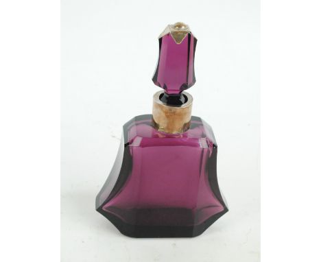 An Art Deco style amethyst decanter with white metal mount and collar, height 26.5cm.   CONDITION REPORT:  Silver collar has 