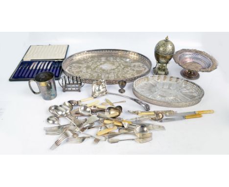 A group of electroplated items to include an oval galleried tray, a ladle, a footed fruit bowl, an egg warmer and a toast rac