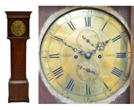 An early 19th century oak longcase clock, the moulded cornice above 13" circular brass dial inscribed 'Upjohn, London' with e