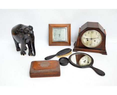A small lot of collectors' items comprising an ebonised circular hand mirror and similar brush, a 1920s oak mantel clock, a s